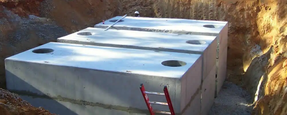 Septic tank installation site with a newly placed concrete tank in Los Angeles, CA